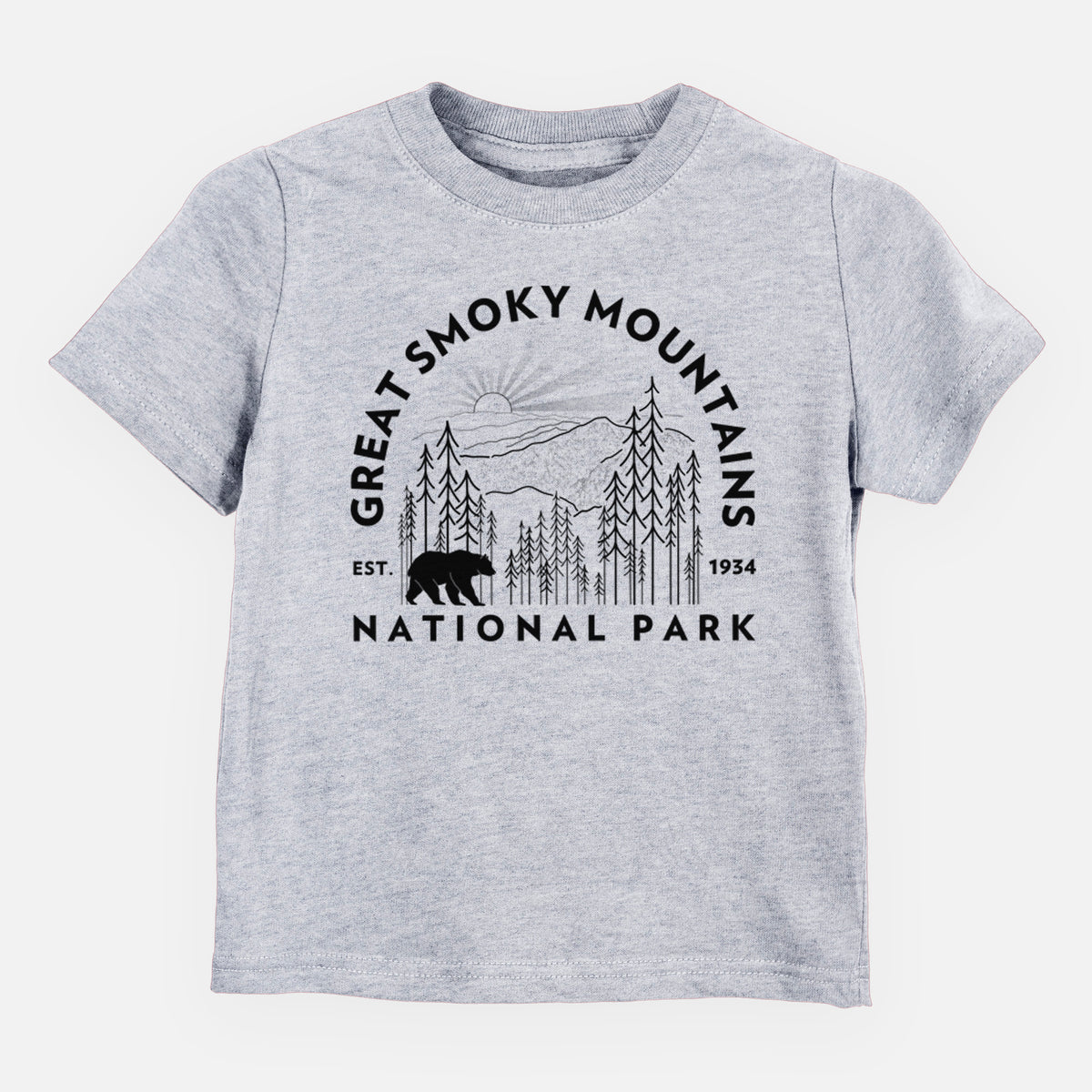 Heather grey toddler t-shirt laid flat, printed with a round badge of mountains, pine trees and a black bear, with the words Great Smoky Mountains National Park, Est. 1934.