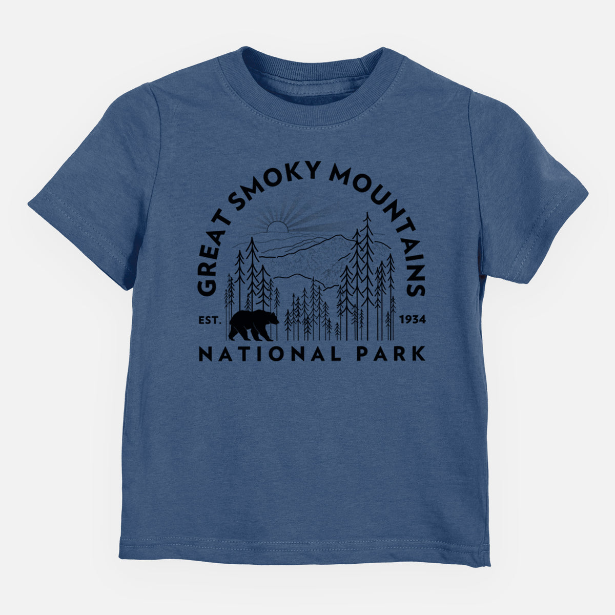 Indigo blue toddler t-shirt laid flat, printed with a round badge of mountains, pine trees and a black bear, with the words Great Smoky Mountains National Park, Est. 1934.