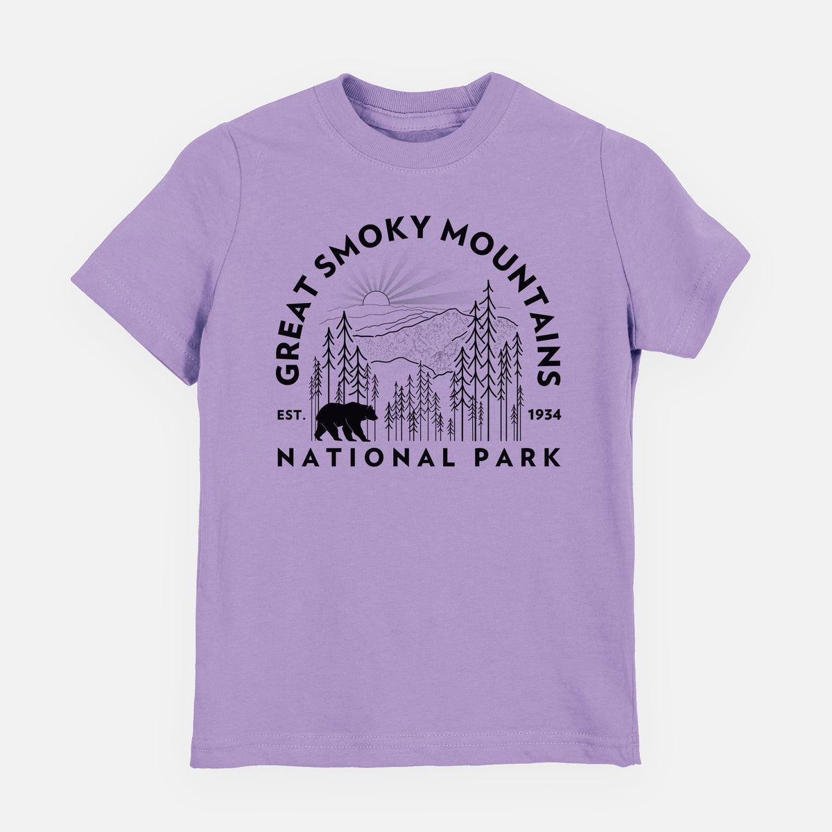 Lavender youth t-shirt laid flat, printed with a round badge of mountains, pine trees and a black bear, with the words Great Smoky Mountains National Park, Est. 1934.