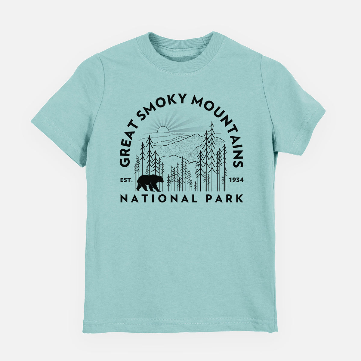 Saltwater youth t-shirt laid flat, printed with a round badge of mountains, pine trees and a black bear, with the words Great Smoky Mountains National Park, Est. 1934.