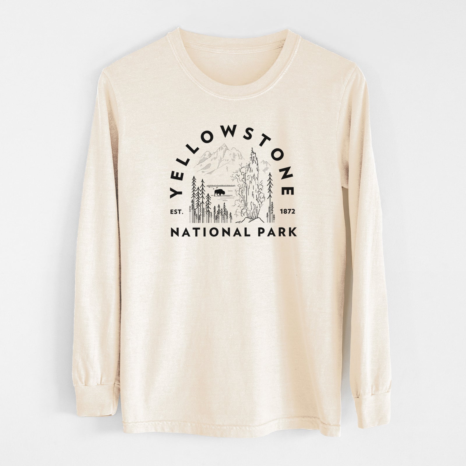 Ivory Comfort Colors long sleeve shirt laid flat, printed with a round badge of a waterfall, pine trees and a bison, with the words Yellowstone National Park, Est. 1872.