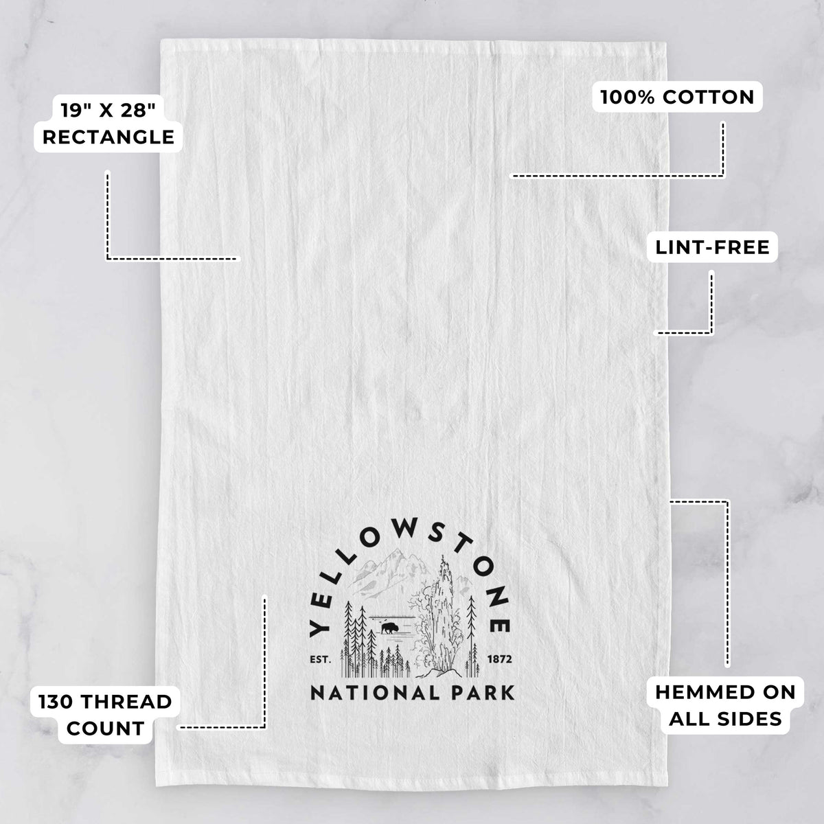 White tea towel printed with a round badge of a waterfall, pine trees and a bison, with the words Yellowstone National Park, Est. 1872, with feature labels: 19 by 28 inch rectangle, 100% cotton, lint-free, 130 thread count, hemmed on all sides.