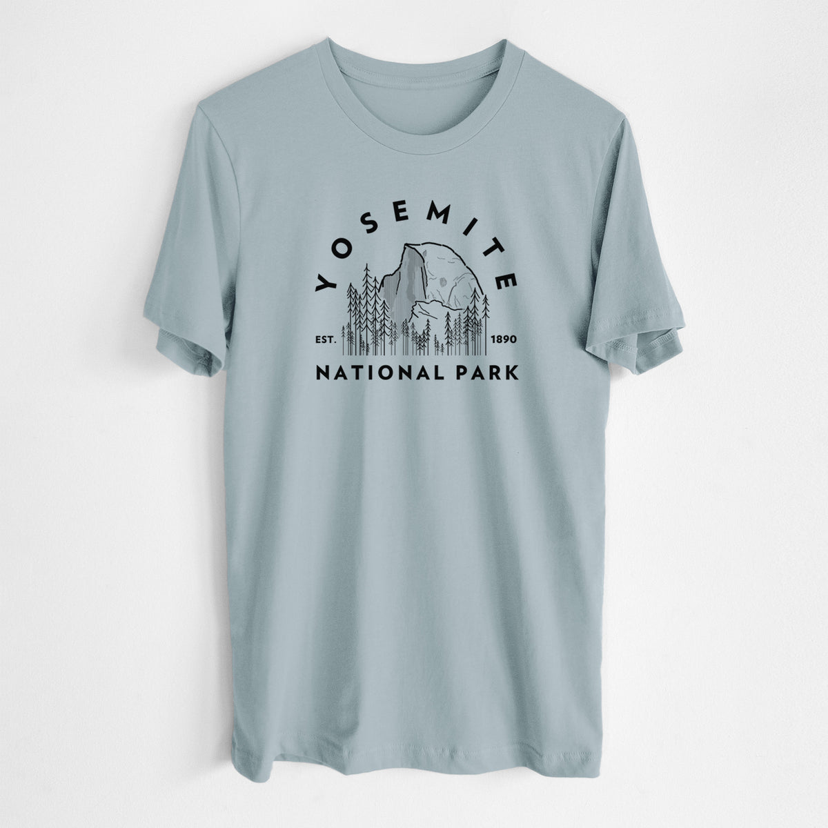 Vintage denim lightweight cotton t-shirt laid flat, printed with a round badge of Half Dome and pine trees, with the words Yosemite National Park, Est. 1890.