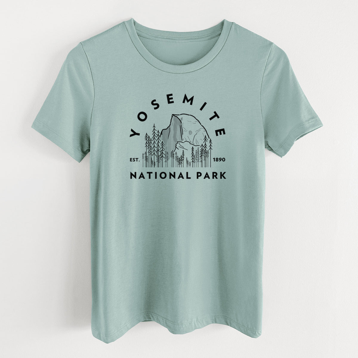 Dusty blue women's relaxed fit cotton t-shirt laid flat, printed with a round badge of Half Dome and pine trees, with the words Yosemite National Park, Est. 1890.