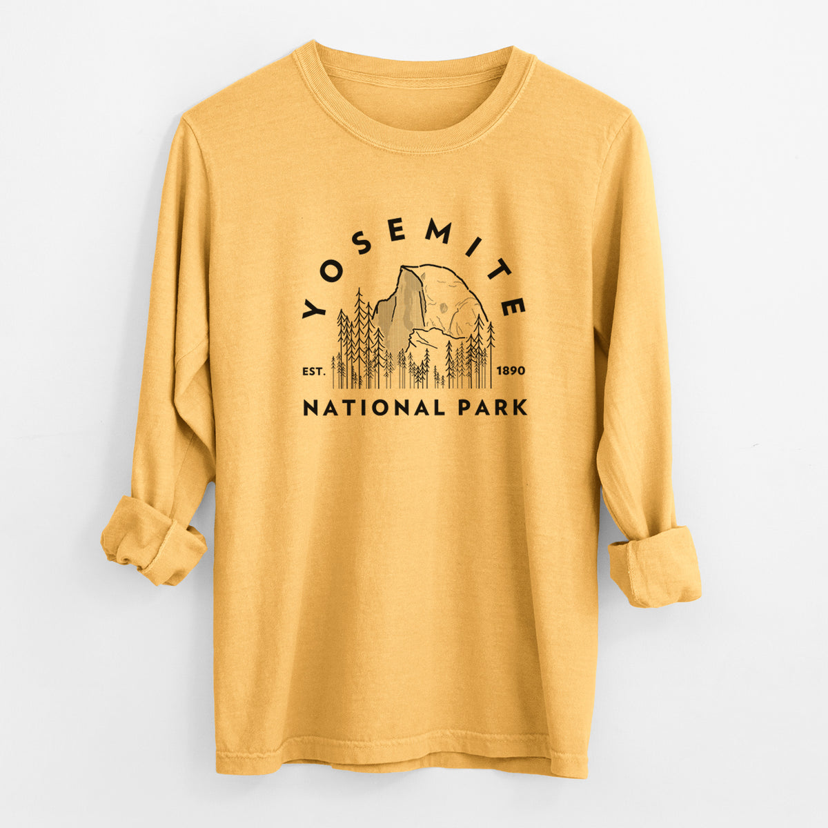 Golden wheat yellow Comfort Colors long sleeve shirt laid flat with the cuffs rolled, printed with a round badge of Half Dome and pine trees, with the words Yosemite National Park, Est. 1890.