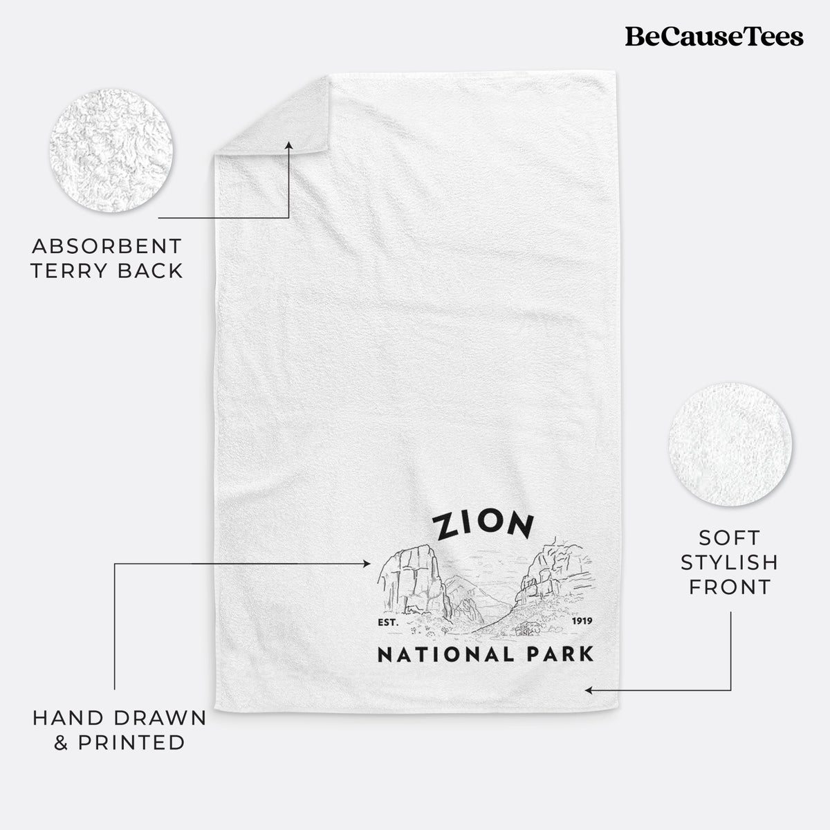 White hand towel printed with a round badge of canyon walls, with the words Zion National Park, Est. 1919.