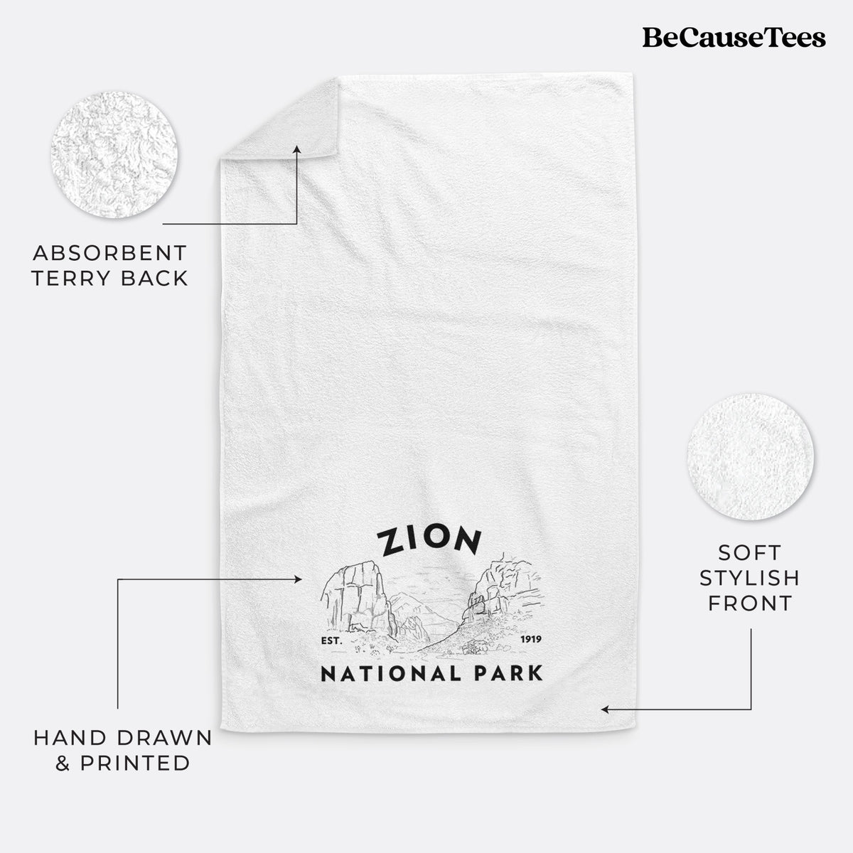 White hand towel printed with a round badge of canyon walls, with the words Zion National Park, Est. 1919.