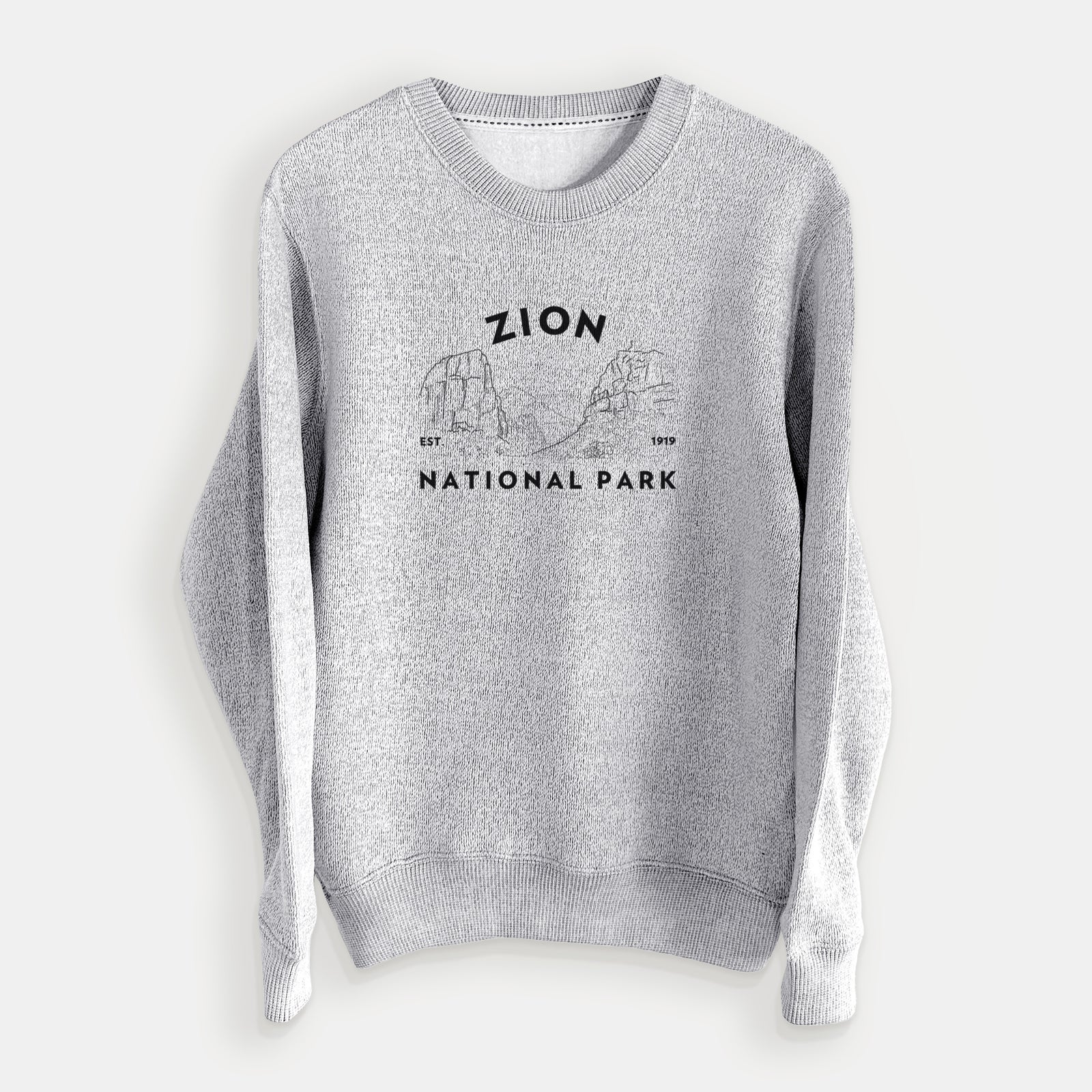 Salt and pepper knit sweatshirt laid flat, printed with a round badge of canyon walls, with the words Zion National Park, Est. 1919.