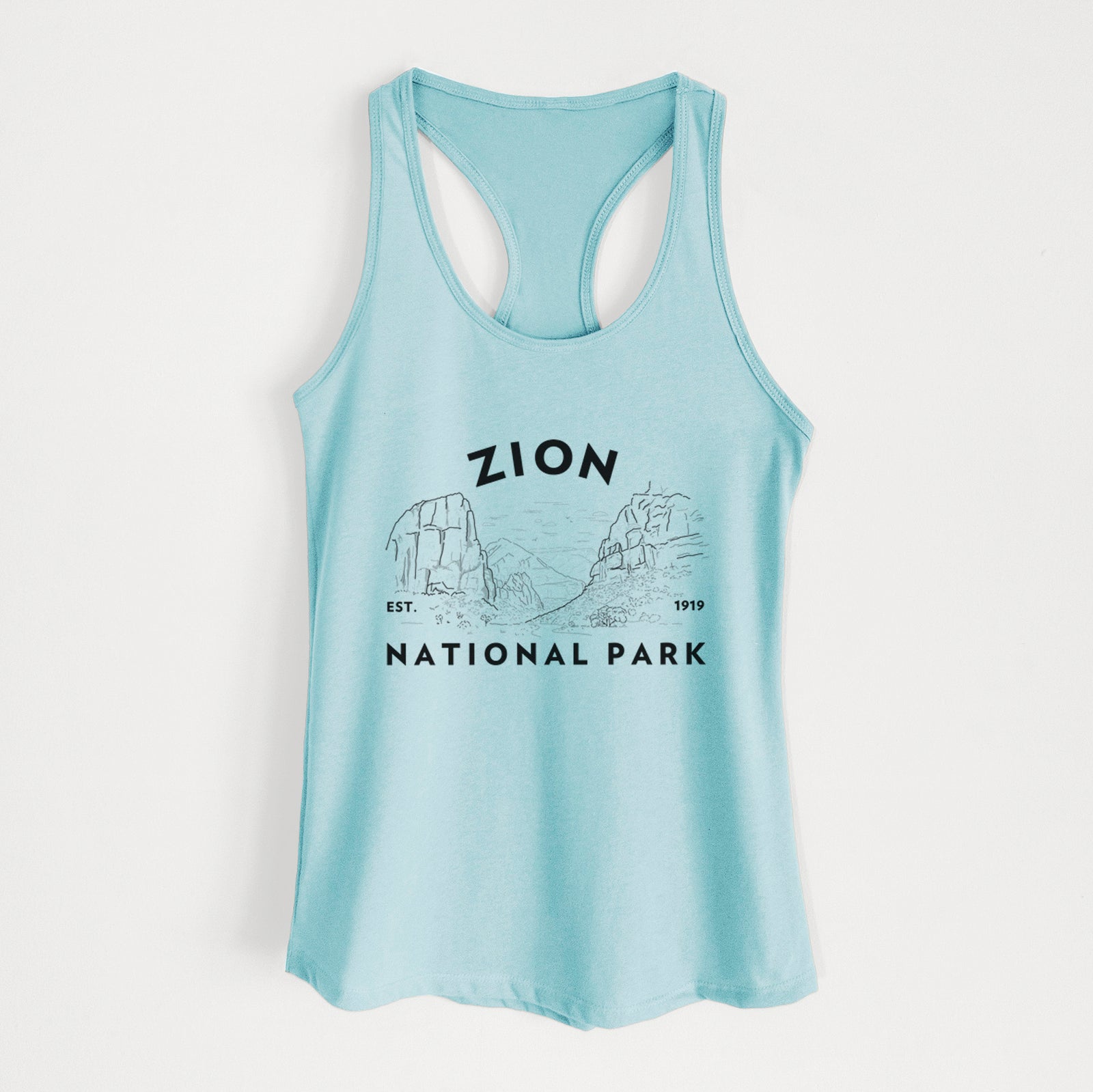 Banana cream women's racerback tank top laid flat, printed with a round badge of canyon walls, with the words Zion National Park, Est. 1919.