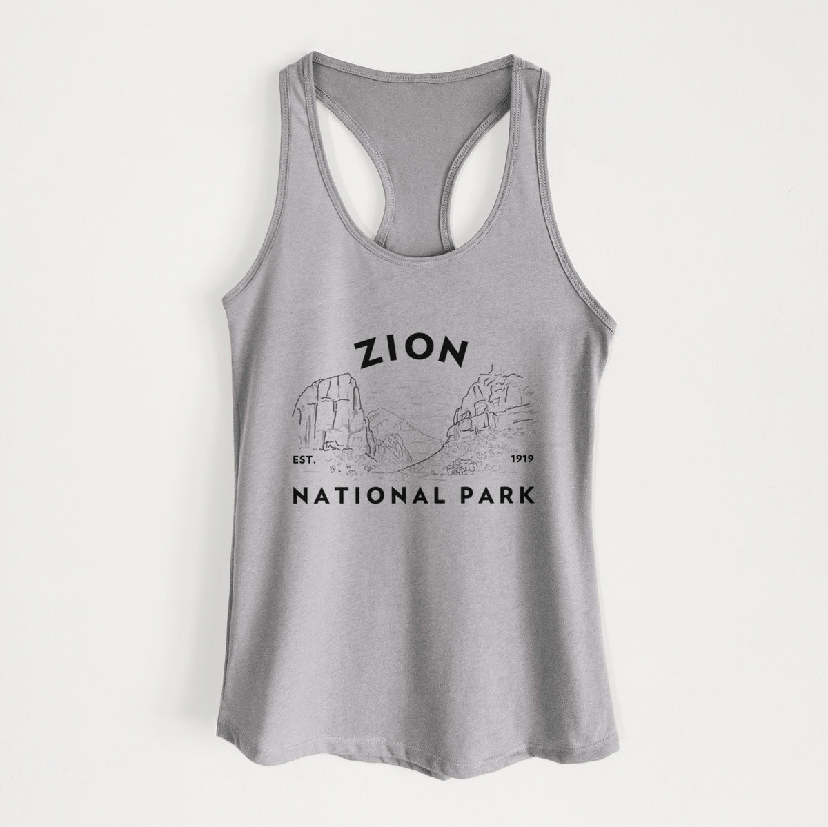 Heather grey women's racerback tank top laid flat, printed with a round badge of canyon walls, with the words Zion National Park, Est. 1919.