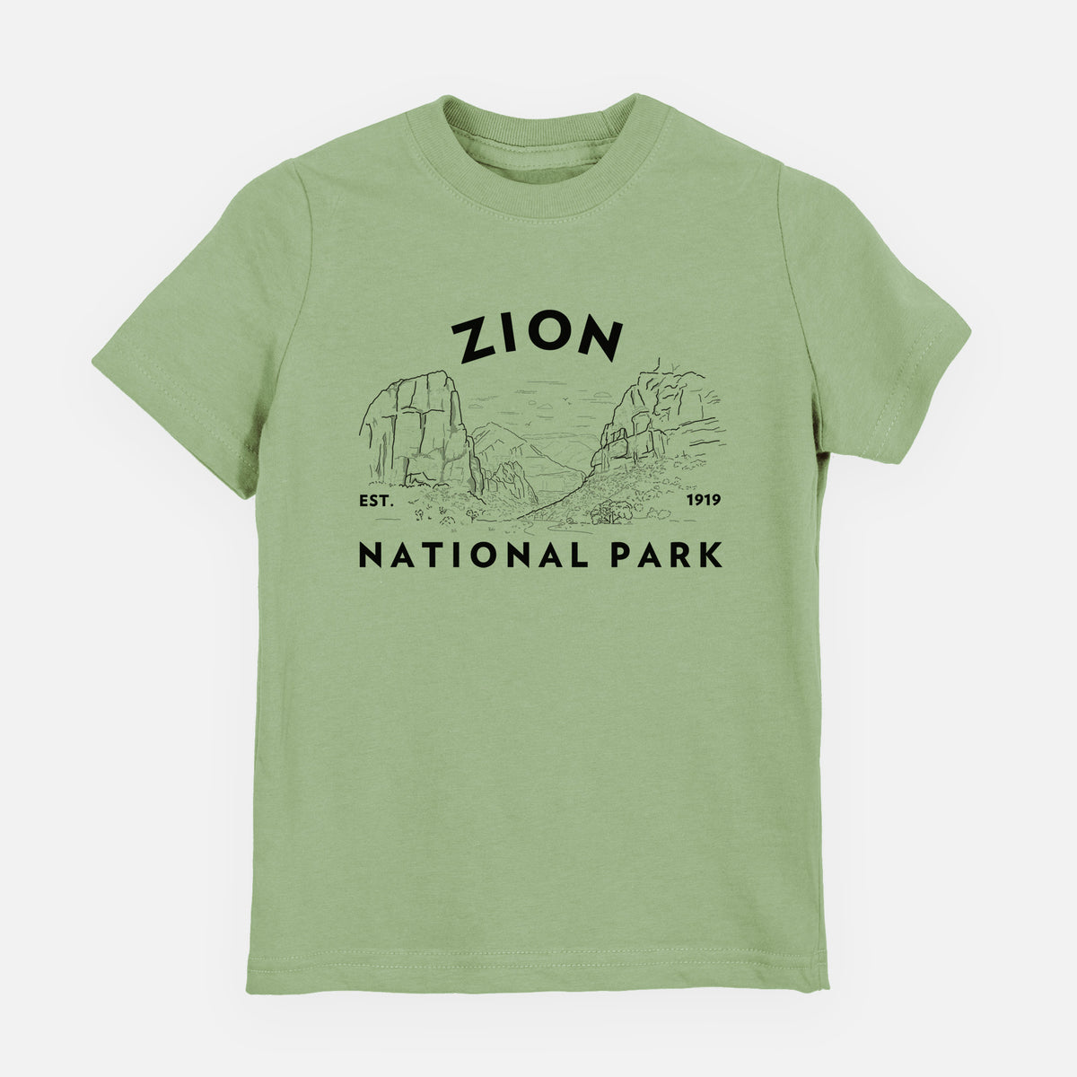 Sage green youth t-shirt laid flat, printed with a round badge of canyon walls, with the words Zion National Park, Est. 1919.