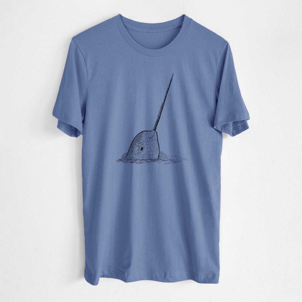 Blue bell lightweight cotton t-shirt laid flat, printed with a black ink illustration of a narwhal with its long spiral tusk pointing upward.