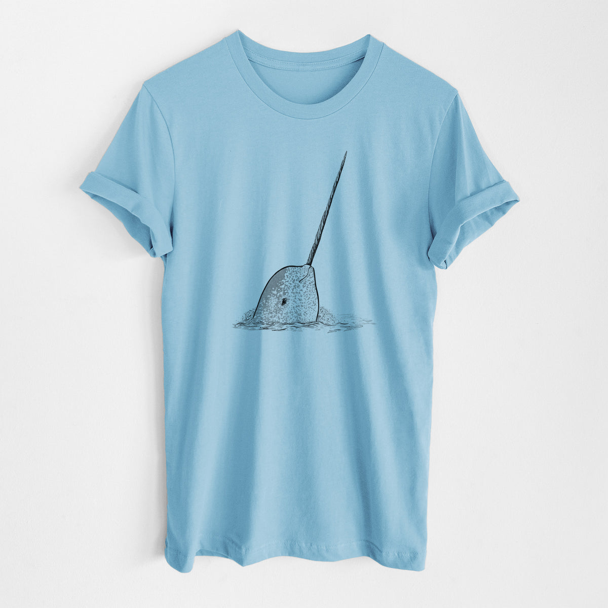 Ocean blue lightweight cotton t-shirt laid flat, printed with a black ink illustration of a narwhal with its long spiral tusk pointing upward.