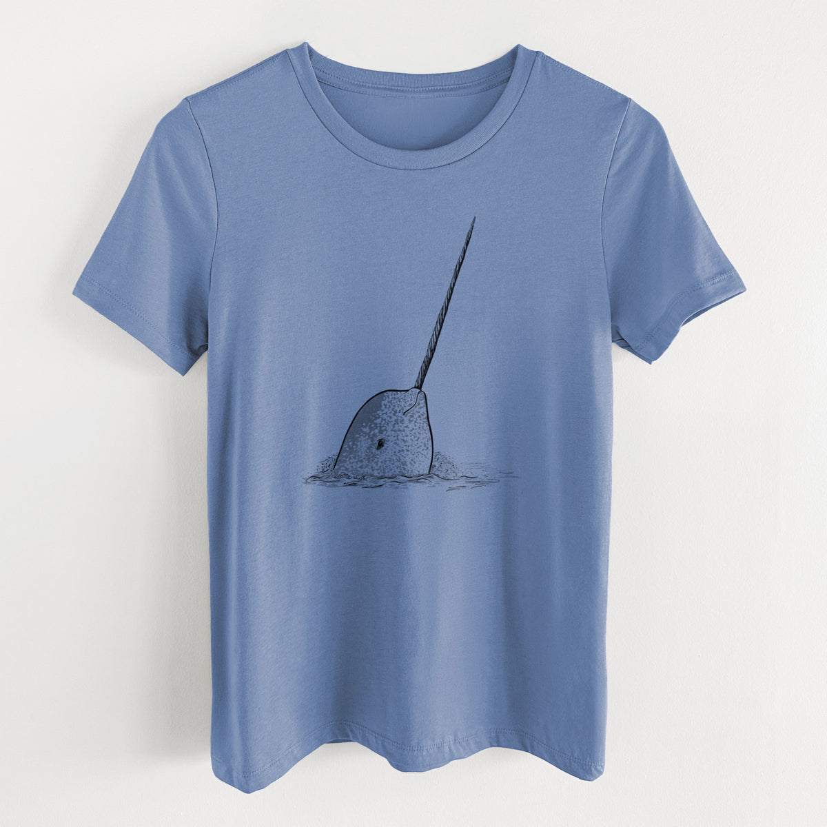 Blue bell women's relaxed fit cotton t-shirt laid flat, printed with a black ink illustration of a narwhal with its long spiral tusk pointing upward.