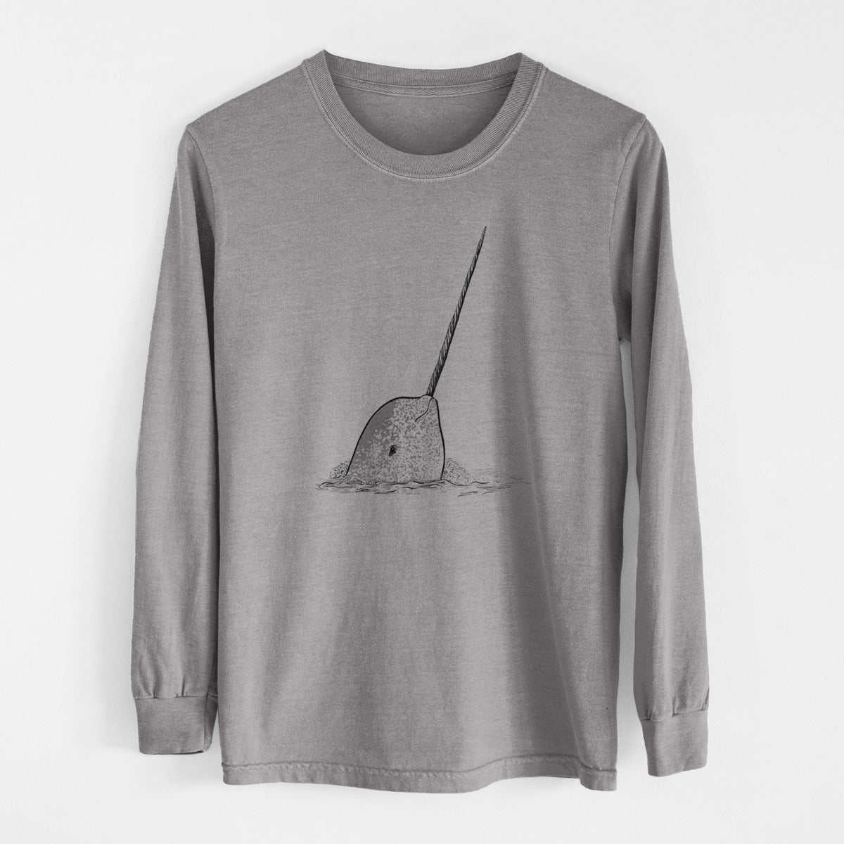 Grey Comfort Colors long sleeve shirt laid flat, printed with a black ink illustration of a narwhal with its long spiral tusk pointing upward.