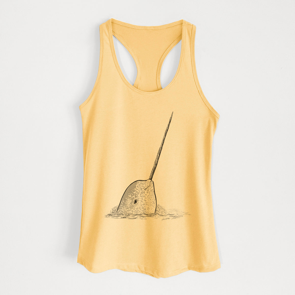 Banana cream women's racerback tank top laid flat, printed with a black ink illustration of a narwhal with its long spiral tusk pointing upward.