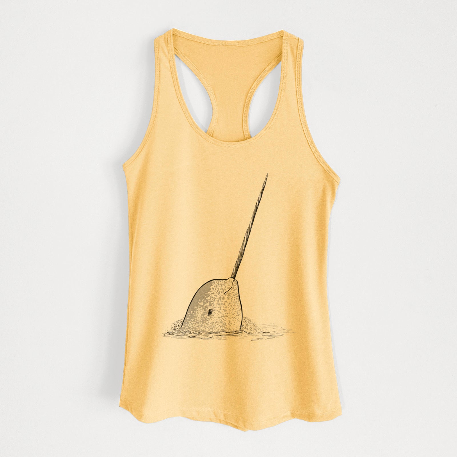 Banana cream women's racerback tank top laid flat, printed with a black ink illustration of a narwhal with its long spiral tusk pointing upward.