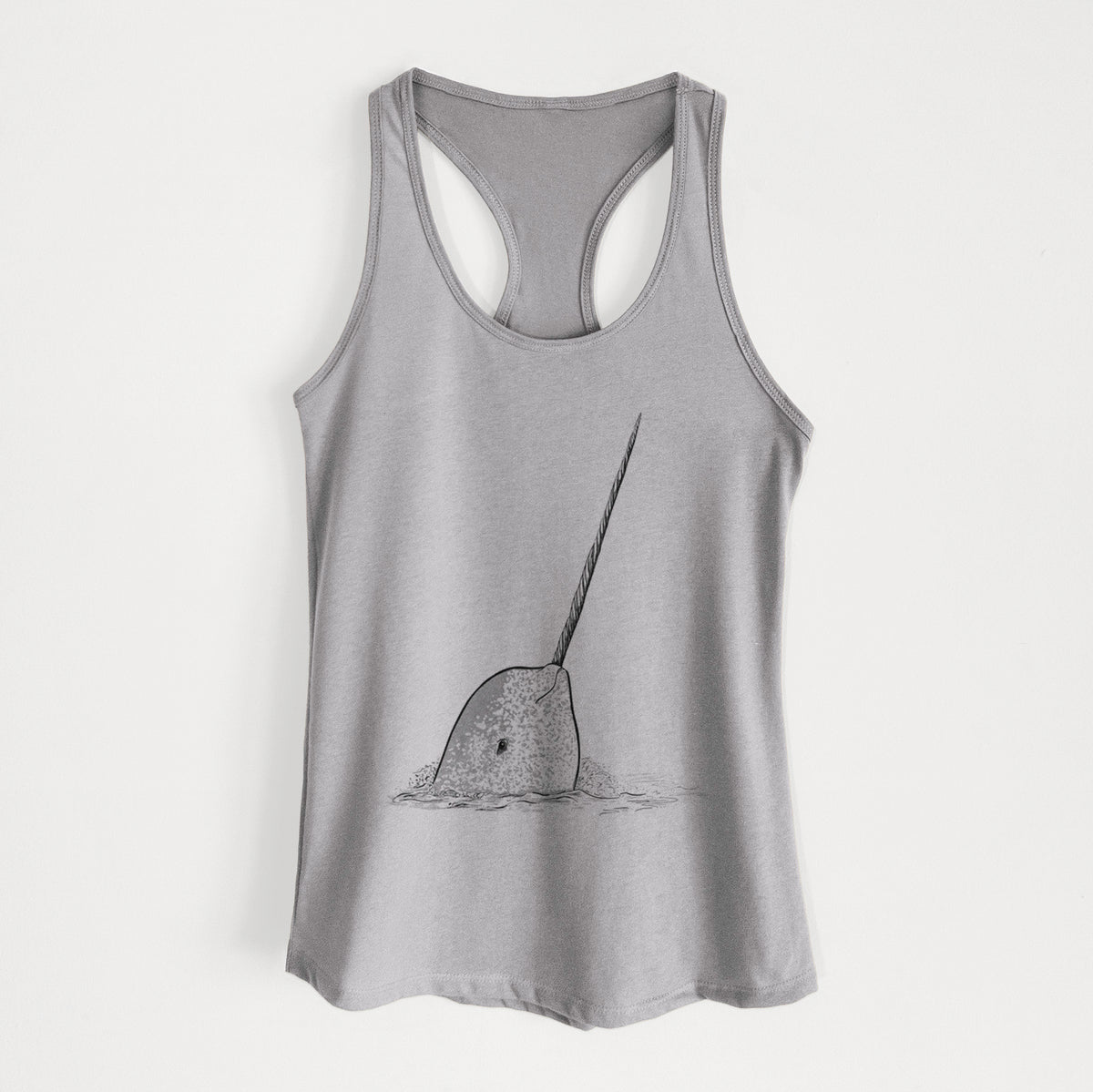 Heather grey women's racerback tank top laid flat, printed with a black ink illustration of a narwhal with its long spiral tusk pointing upward.