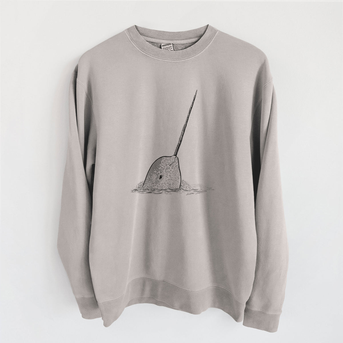 Cement grey pigment dyed crewneck sweatshirt laid flat, printed with a black ink illustration of a narwhal with its long spiral tusk pointing upward.