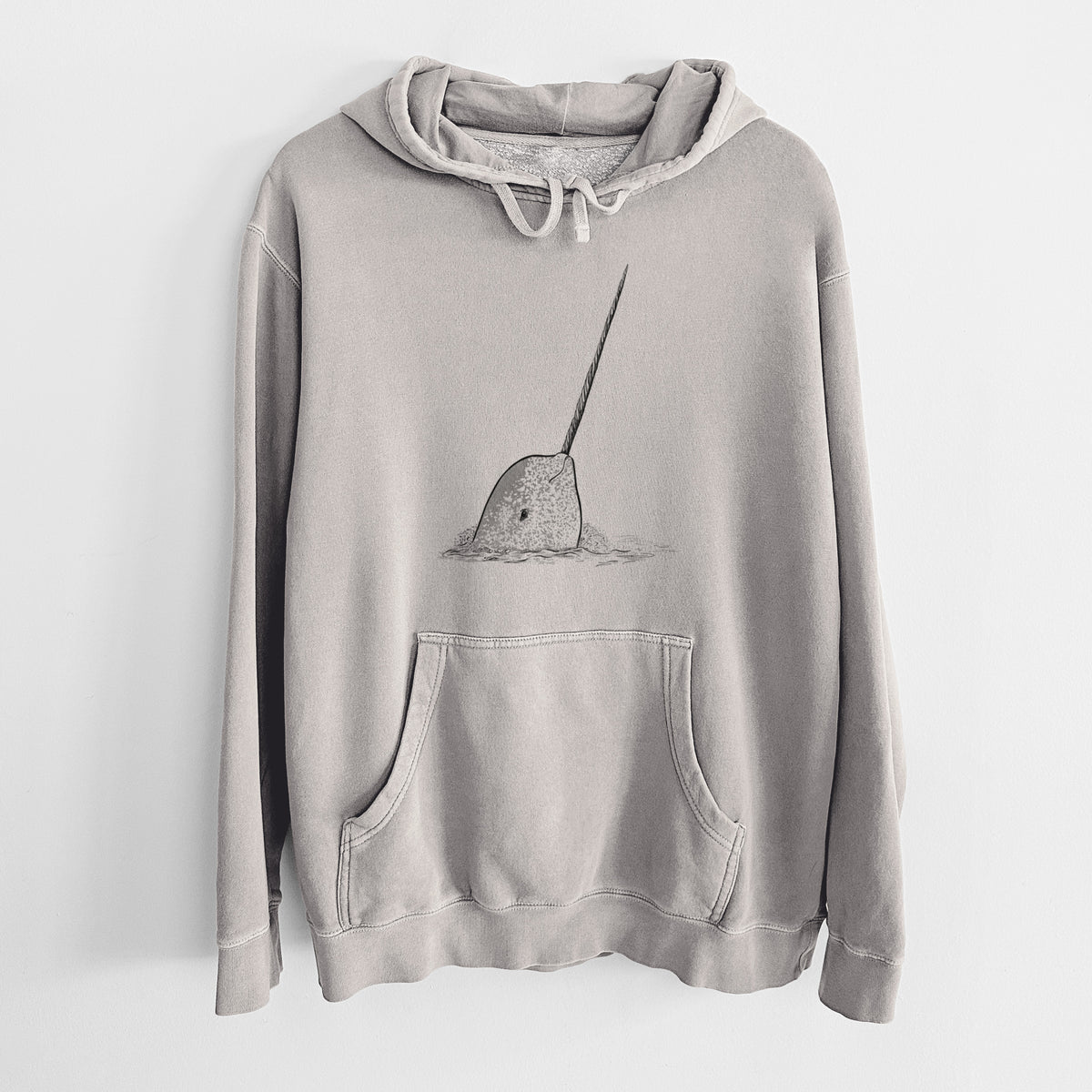 Cement grey pigment dyed hoodie laid flat, printed with a black ink illustration of a narwhal with its long spiral tusk pointing upward.