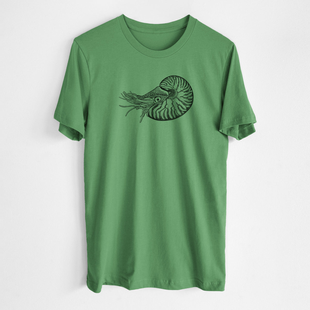 Leaf green lightweight cotton t-shirt laid flat, printed with a detailed black ink illustration of a chambered nautilus with its striped spiral shell and tentacles.