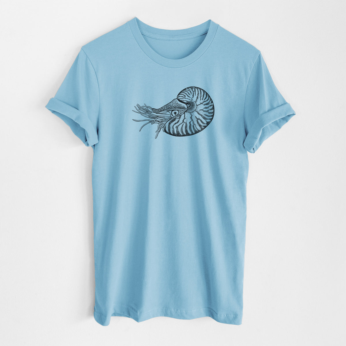 Ocean blue lightweight cotton t-shirt laid flat, printed with a detailed black ink illustration of a chambered nautilus with its striped spiral shell and tentacles.