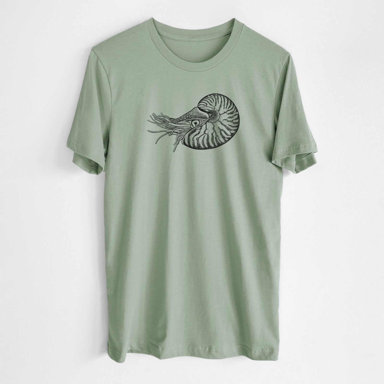 Sage green lightweight cotton t-shirt laid flat, printed with a detailed black ink illustration of a chambered nautilus with its striped spiral shell and tentacles.