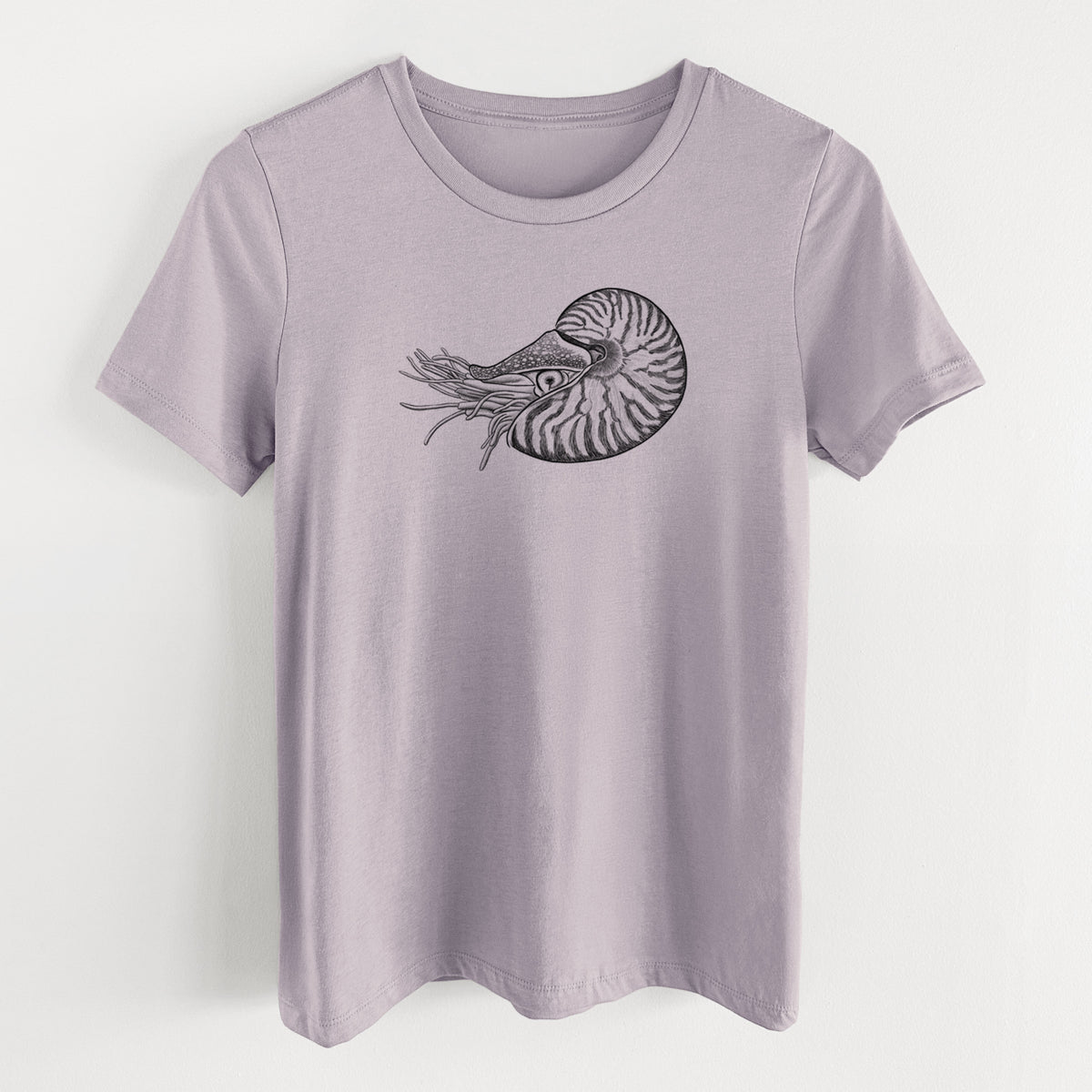 Light violet women's relaxed fit cotton t-shirt laid flat, printed with a detailed black ink illustration of a chambered nautilus with its striped spiral shell and tentacles.