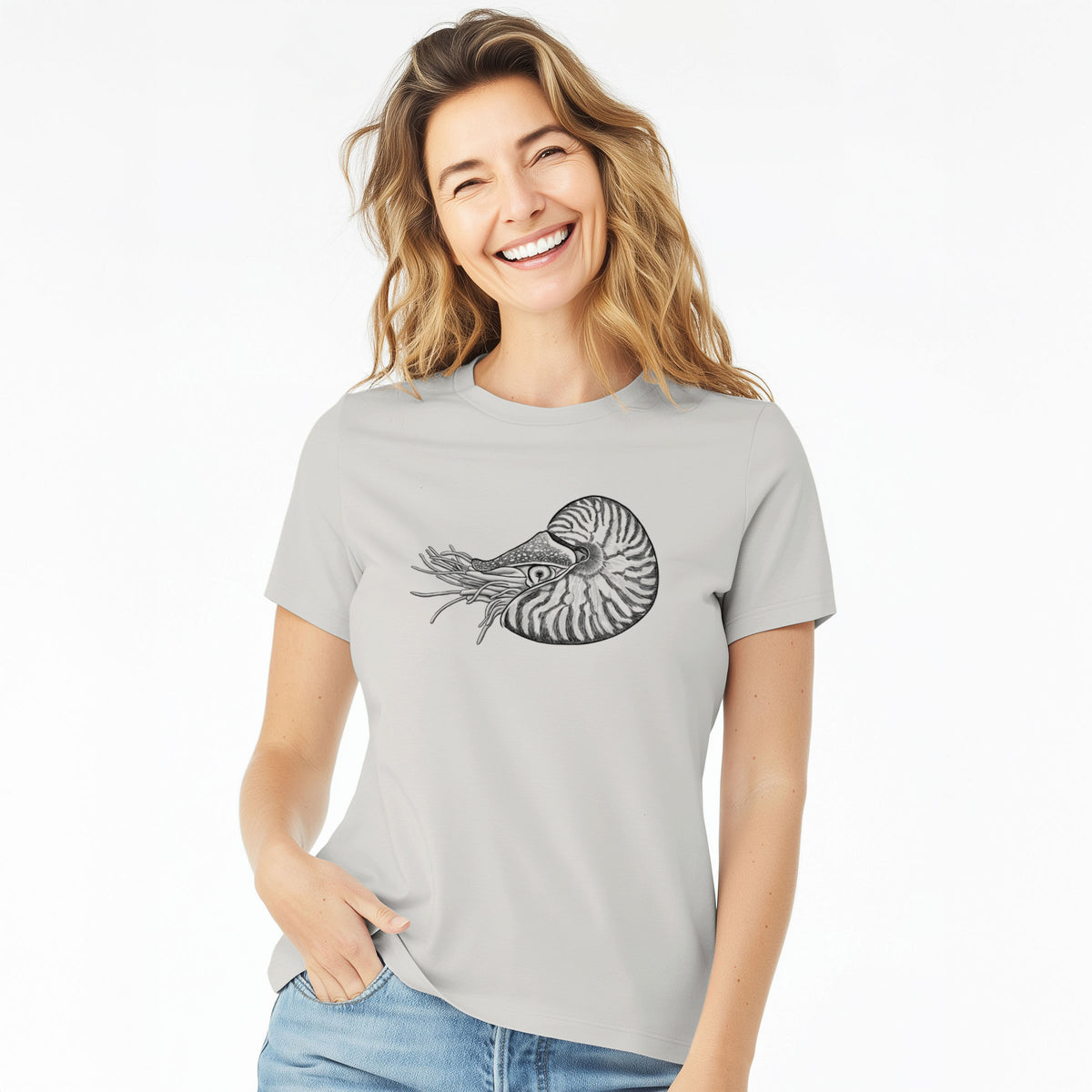 Woman wearing a lunar grey women's relaxed fit cotton t-shirt printed with a detailed black ink illustration of a chambered nautilus with its striped spiral shell and tentacles.
