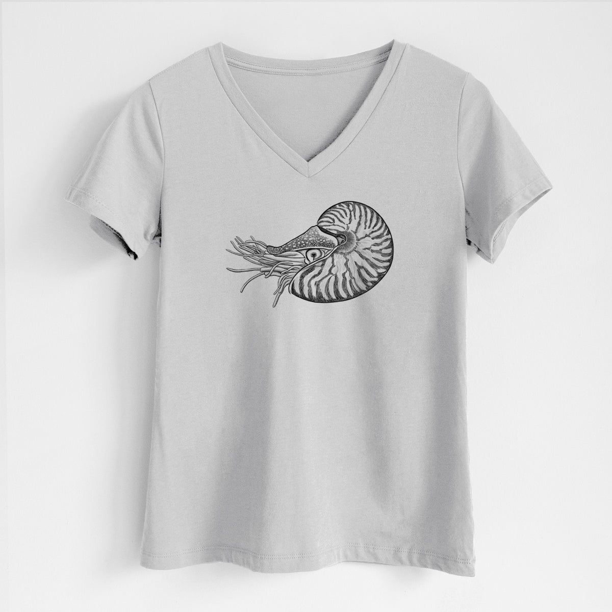 Lunar grey women's relaxed fit cotton V-neck t-shirt laid flat, printed with a detailed black ink illustration of a chambered nautilus with its striped spiral shell and tentacles.