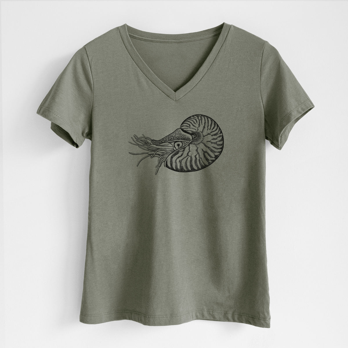 Military green women's relaxed fit cotton V-neck t-shirt laid flat, printed with a detailed black ink illustration of a chambered nautilus with its striped spiral shell and tentacles.