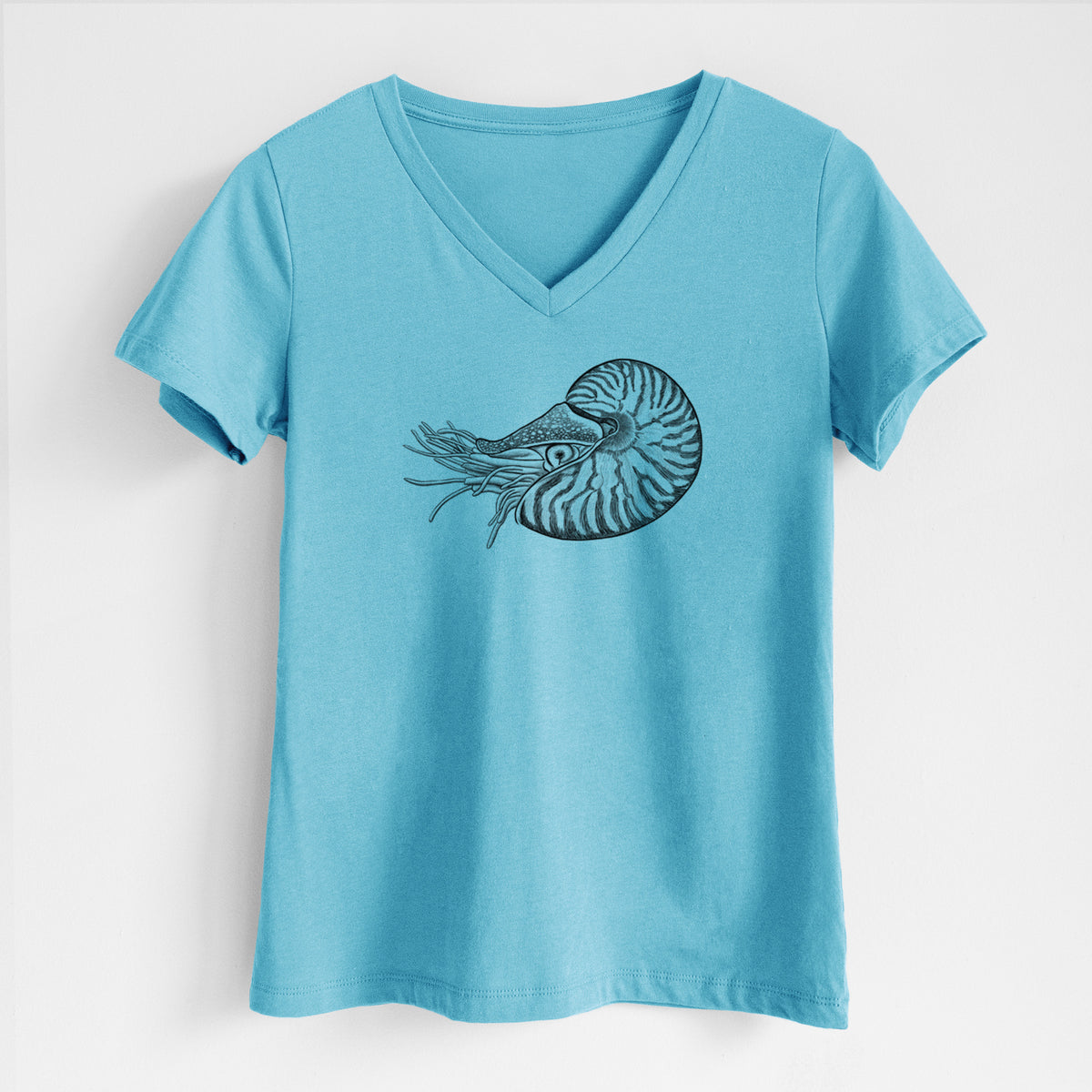 Turquoise women's relaxed fit cotton V-neck t-shirt laid flat, printed with a detailed black ink illustration of a chambered nautilus with its striped spiral shell and tentacles.