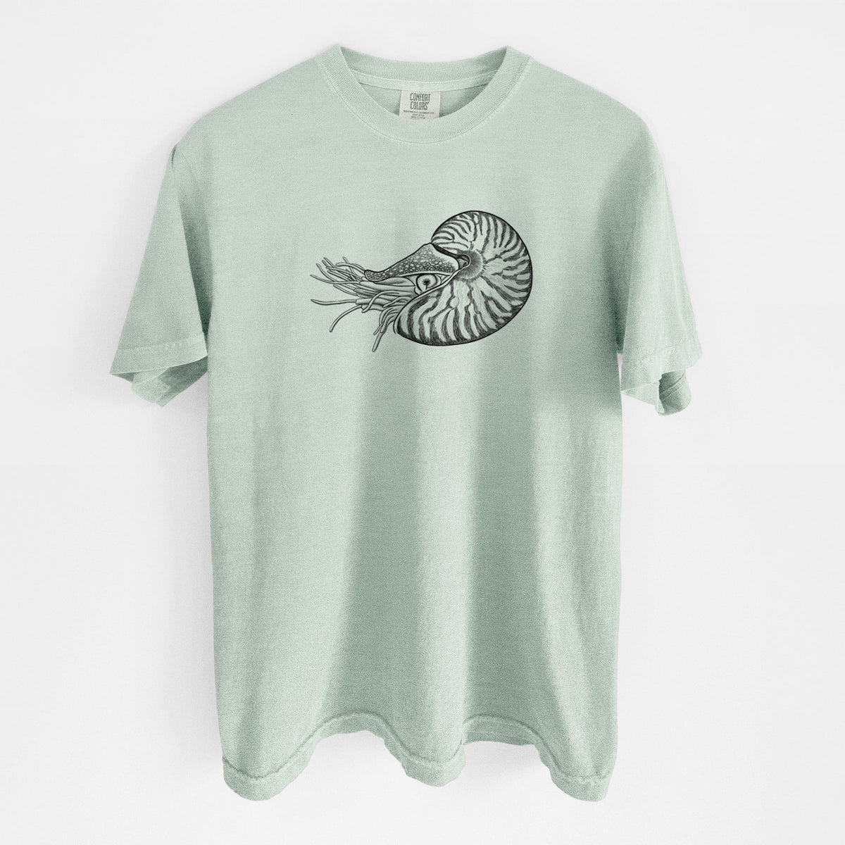 Bay green Comfort Colors t-shirt laid flat, printed with a detailed black ink illustration of a chambered nautilus with its striped spiral shell and tentacles.