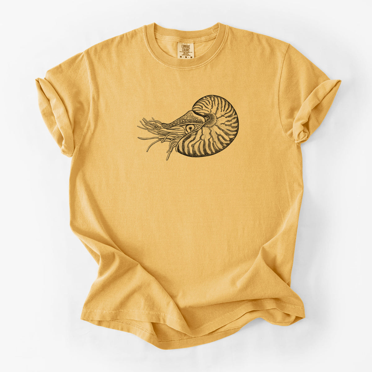 Golden wheat yellow Comfort Colors t-shirt laid flat, printed with a detailed black ink illustration of a chambered nautilus with its striped spiral shell and tentacles.