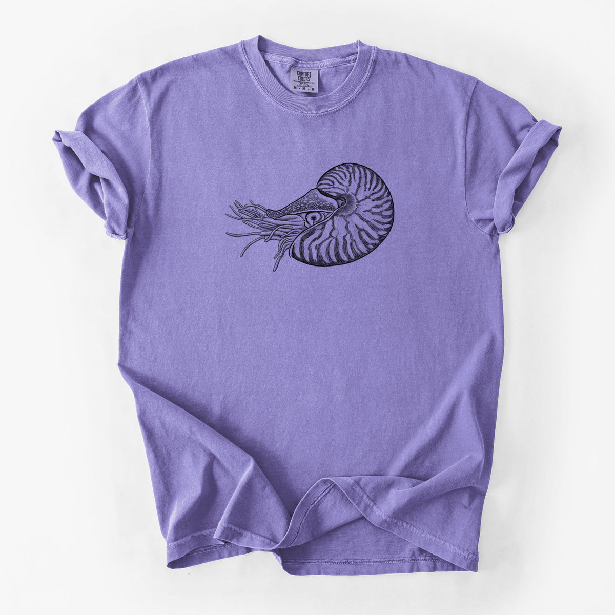 Violet purple Comfort Colors t-shirt laid flat, printed with a detailed black ink illustration of a chambered nautilus with its striped spiral shell and tentacles.