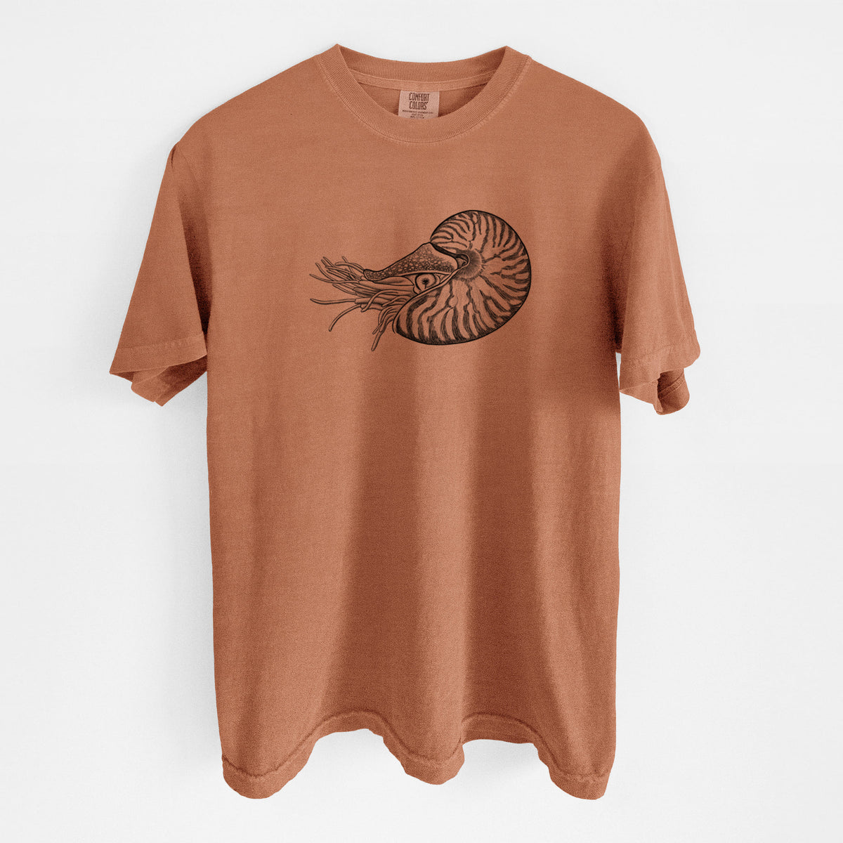 Yam burnt orange Comfort Colors t-shirt laid flat, printed with a detailed black ink illustration of a chambered nautilus with its striped spiral shell and tentacles.