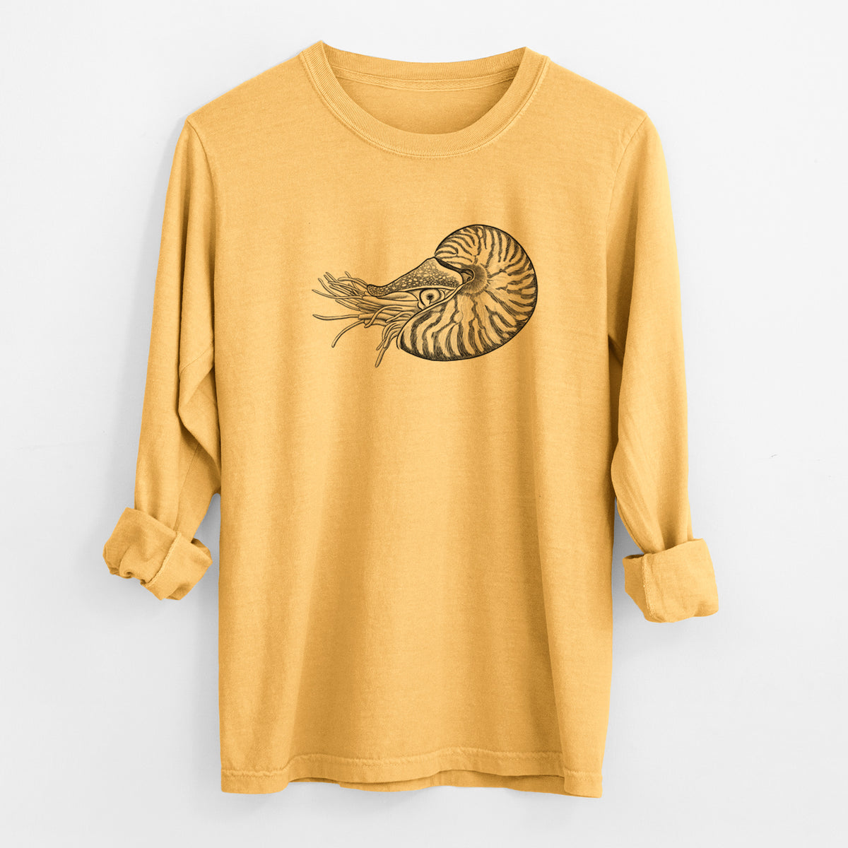 Golden wheat yellow Comfort Colors long sleeve shirt laid flat with the cuffs rolled, printed with a detailed black ink illustration of a chambered nautilus with its striped spiral shell and tentacles.