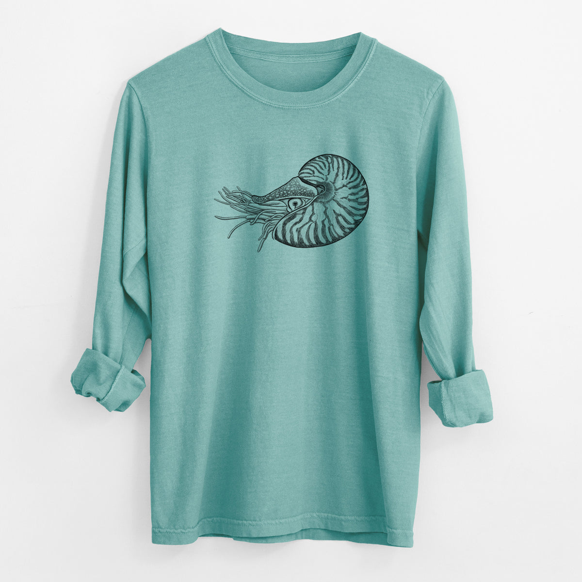 Reef green Comfort Colors long sleeve shirt laid flat with the cuffs rolled, printed with a detailed black ink illustration of a chambered nautilus with its striped spiral shell and tentacles.