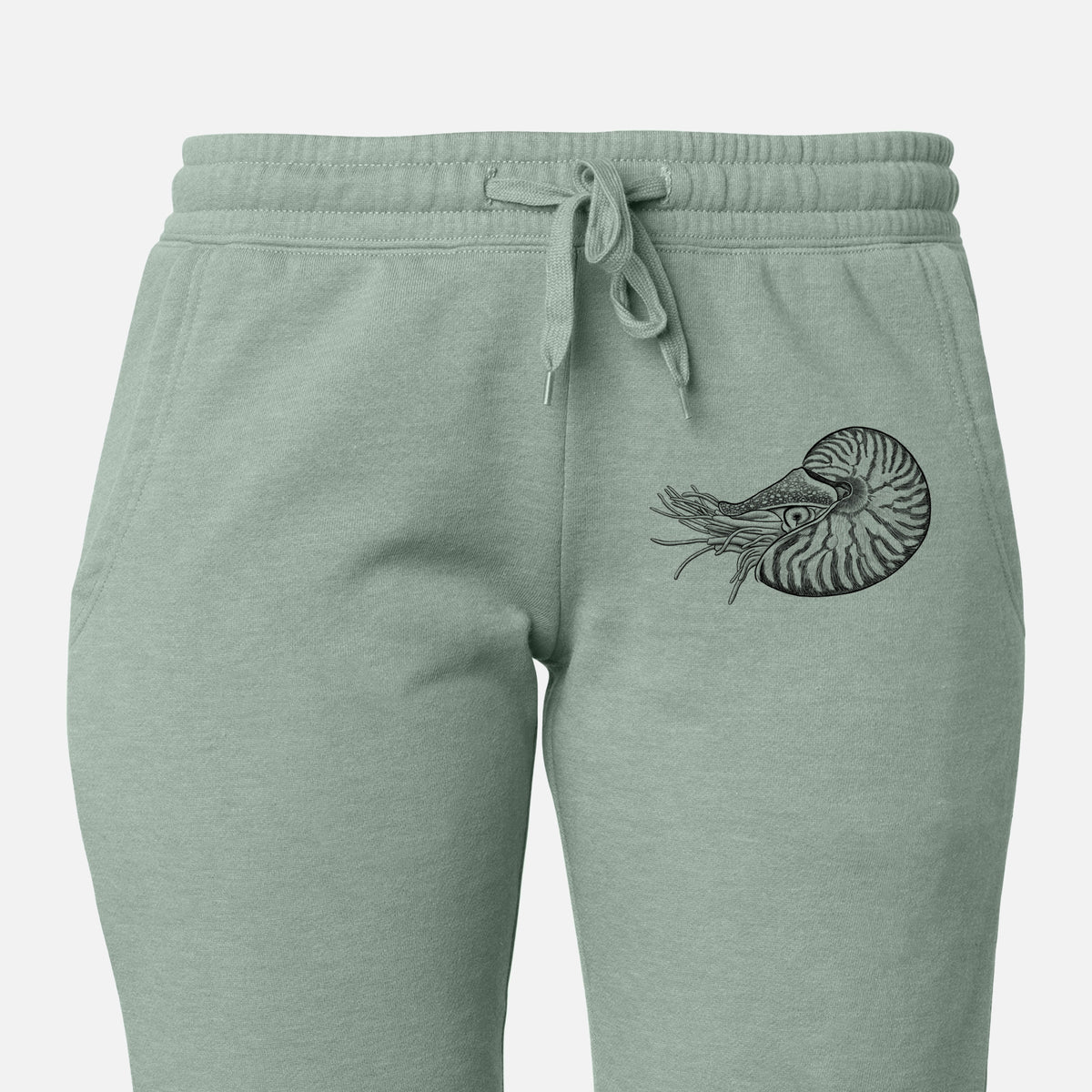 Front of sage green Cali Wave sweatpants, printed with a detailed black ink illustration of a chambered nautilus with its striped spiral shell and tentacles on the leg.
