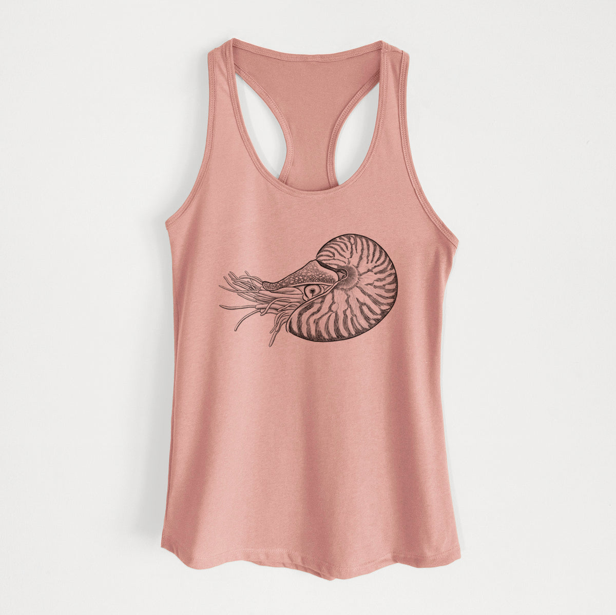 Desert pink women's racerback tank top laid flat, printed with a detailed black ink illustration of a chambered nautilus with its striped spiral shell and tentacles.