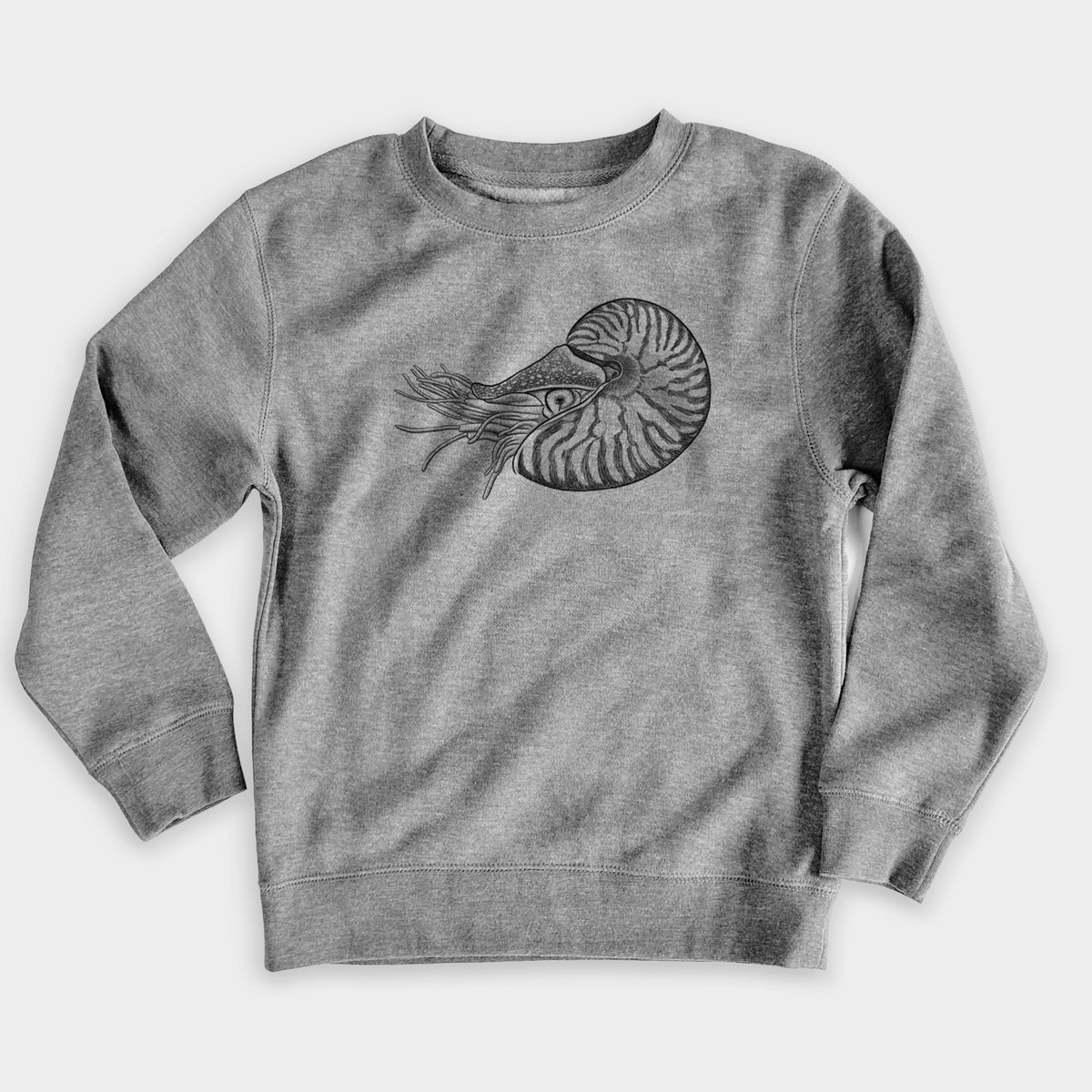 Nickel grey youth crewneck sweatshirt laid flat, printed with a detailed black ink illustration of a chambered nautilus with its striped spiral shell and tentacles.