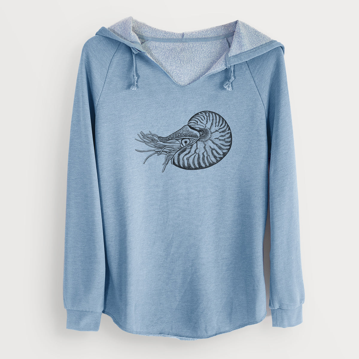 Misty blue women's Cali Wave hooded sweatshirt laid flat, printed with a detailed black ink illustration of a chambered nautilus with its striped spiral shell and tentacles.