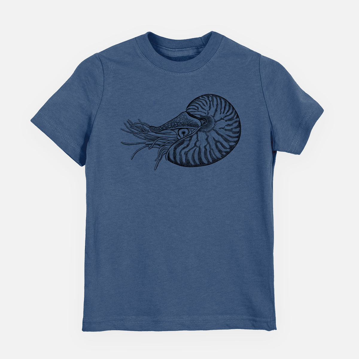 Indigo blue youth t-shirt laid flat, printed with a detailed black ink illustration of a chambered nautilus with its striped spiral shell and tentacles.