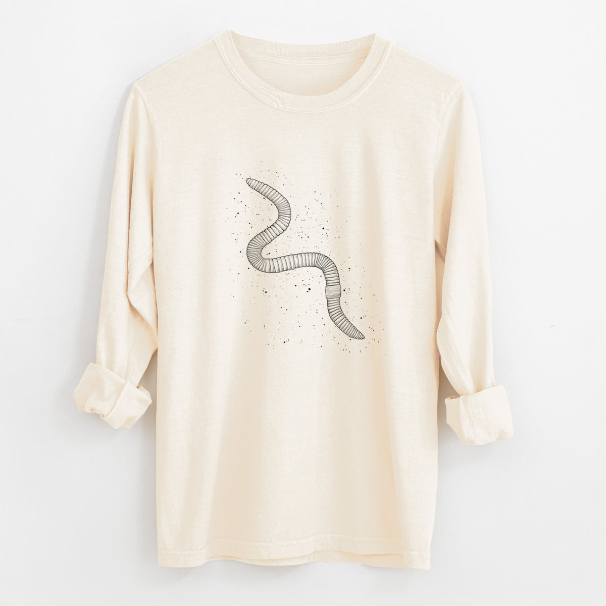 Ivory Comfort Colors long sleeve shirt laid flat with the cuffs rolled, printed with a black ink illustration of a nightcrawler earthworm with soil specks.