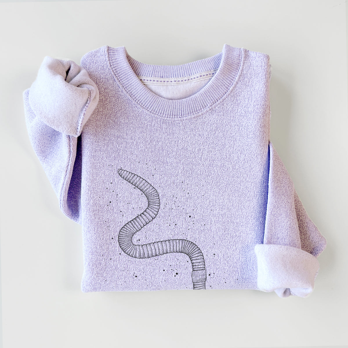Ice purple knit sweatshirt printed with a black ink illustration of a nightcrawler earthworm with soil specks, styled flat.