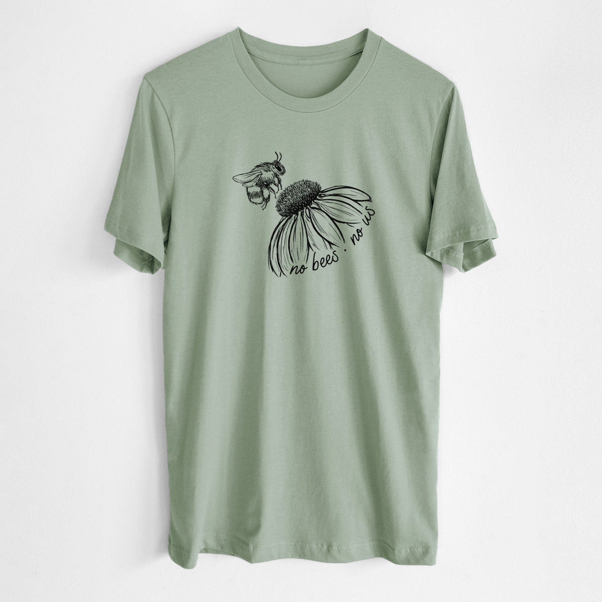 Sage green lightweight cotton t-shirt laid flat, printed with a black ink illustration of a bee flying toward a coneflower, with the handwritten words no bees no us.