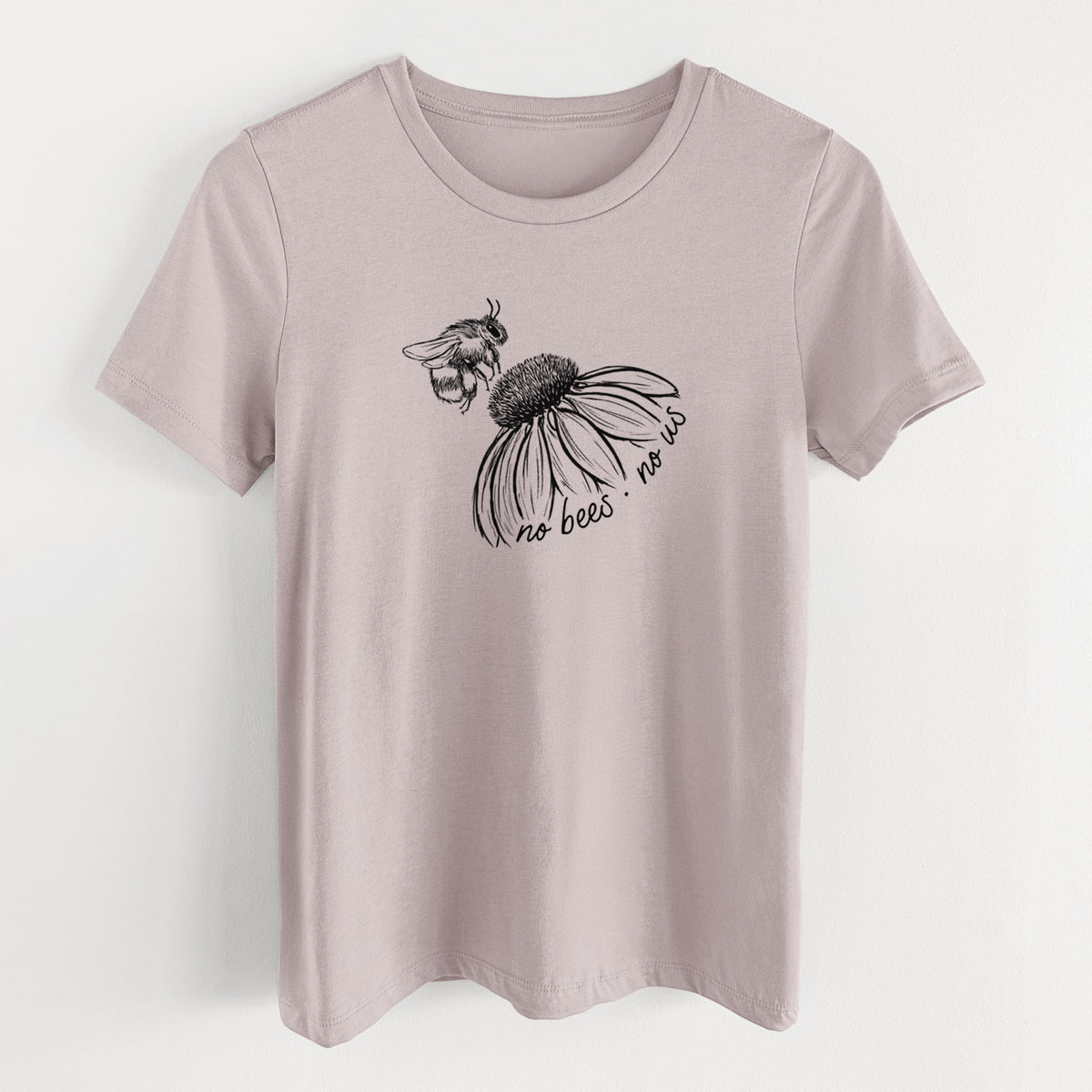 Pink gravel women's relaxed fit cotton t-shirt laid flat, printed with a black ink illustration of a bee flying toward a coneflower, with the handwritten words no bees no us.