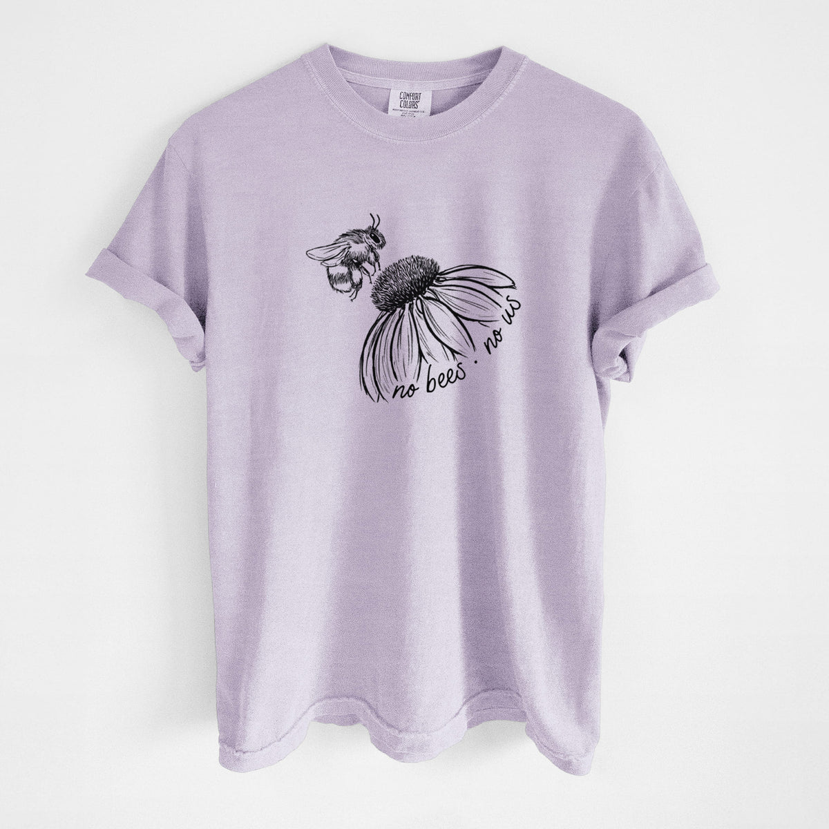Orchid purple Comfort Colors t-shirt laid flat, printed with a black ink illustration of a bee flying toward a coneflower, with the handwritten words no bees no us.
