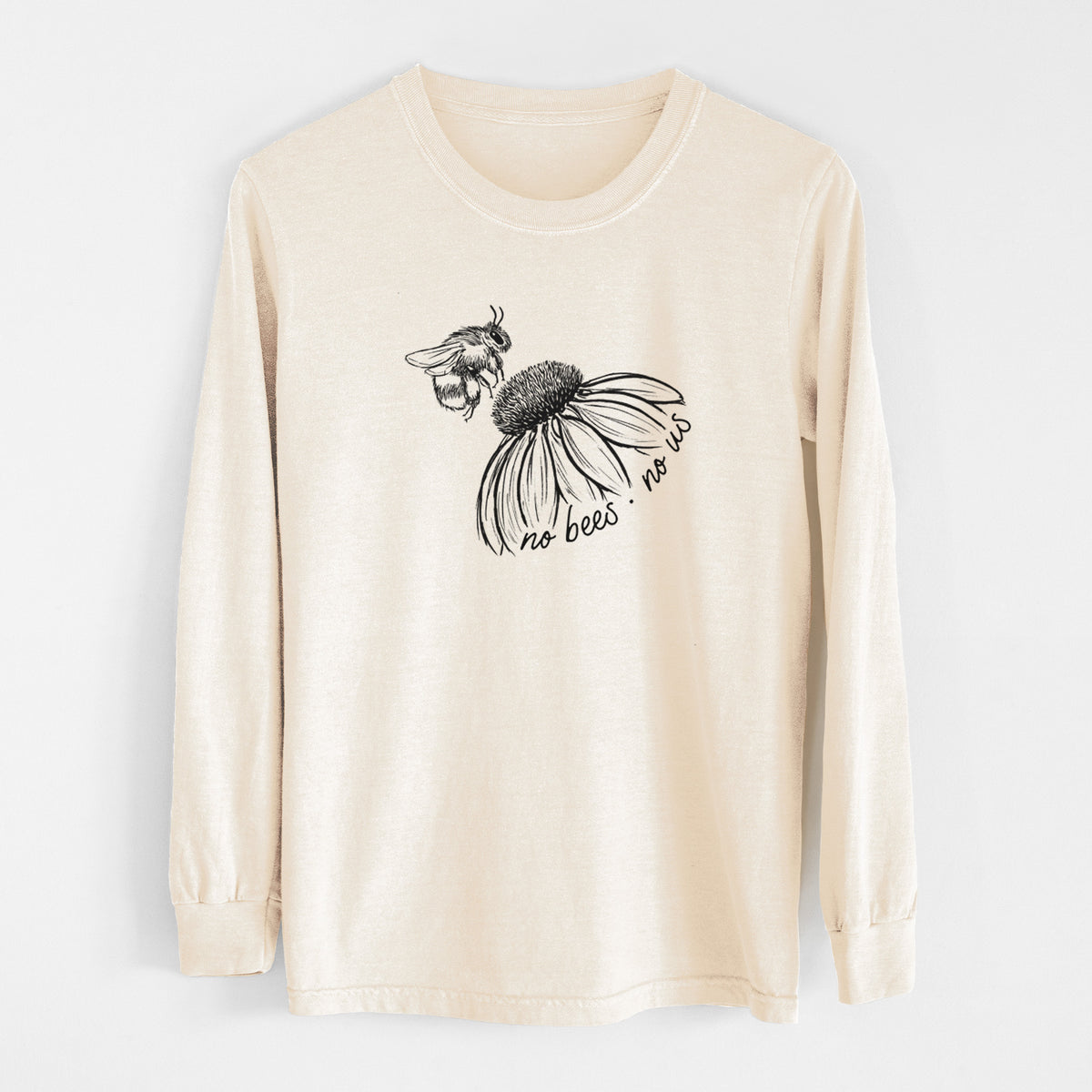 Ivory Comfort Colors long sleeve shirt laid flat, printed with a black ink illustration of a bee flying toward a coneflower, with the handwritten words no bees no us.