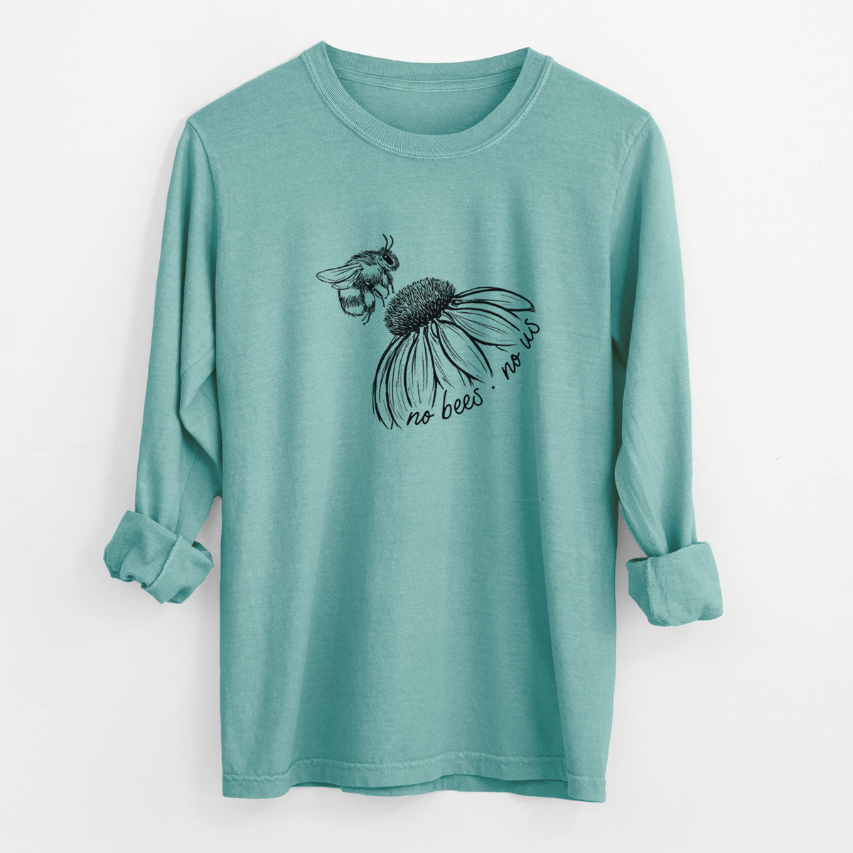 Reef green Comfort Colors long sleeve shirt laid flat with the cuffs rolled, printed with a black ink illustration of a bee flying toward a coneflower, with the handwritten words no bees no us.